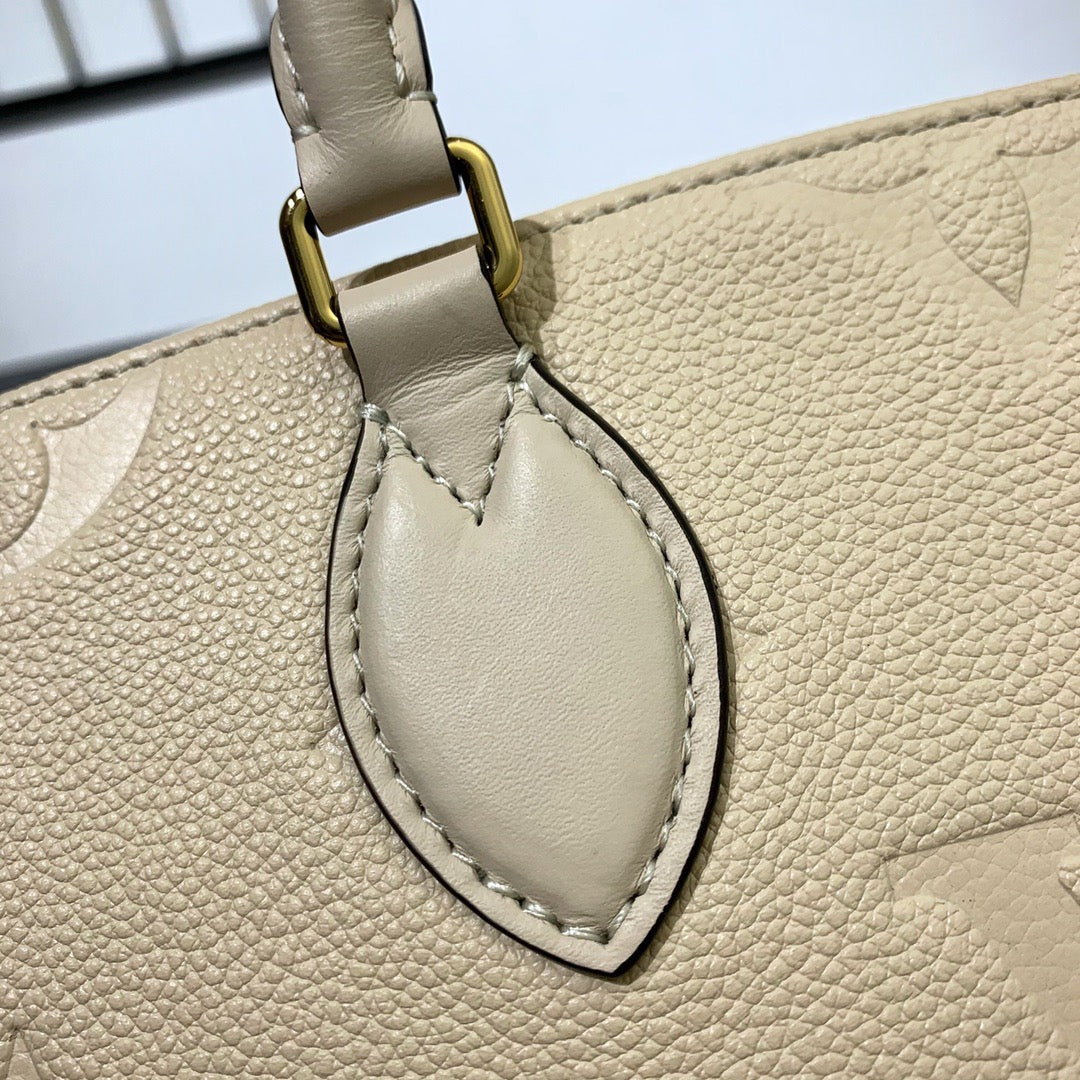Cream Monogram Empreinte Leather OnTheGo PM - Leather Tote Bag for Women