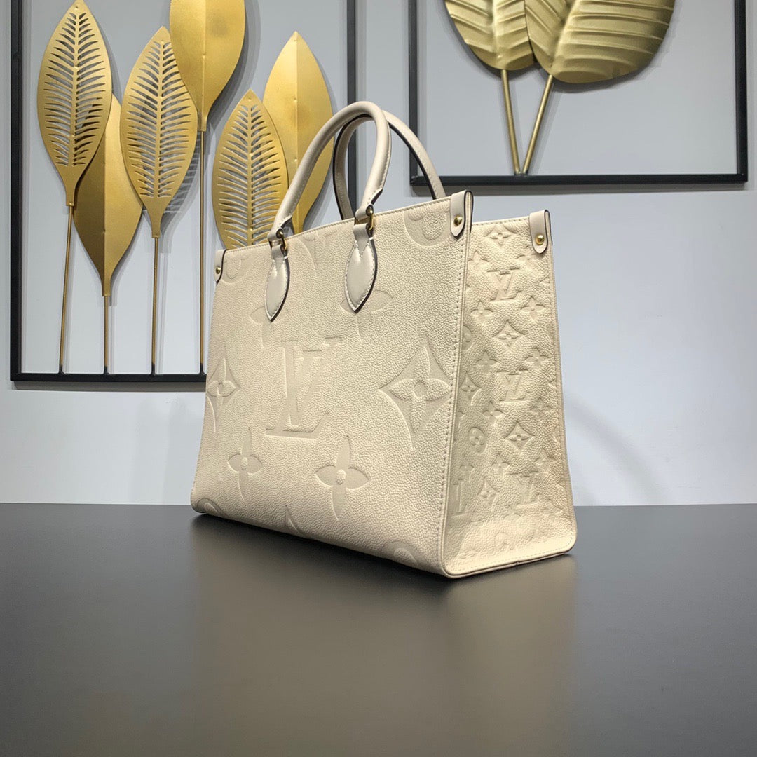 Cream Monogram Empreinte Leather OnTheGo MM