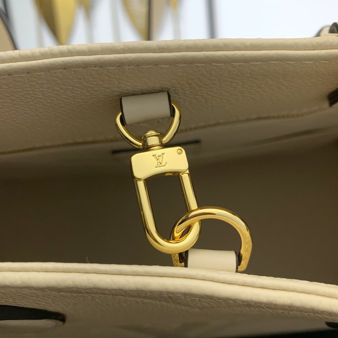 Cream Monogram Empreinte Leather OnTheGo MM