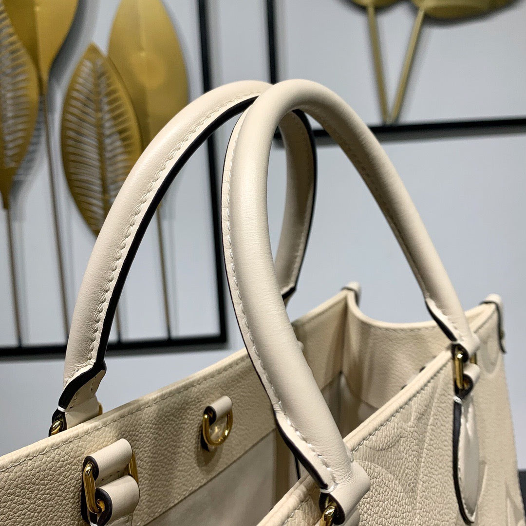 Cream Monogram Empreinte Leather OnTheGo MM