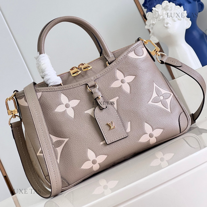 Bicolor Monogram Empreinte Leather Trianon PM - Leather Handbag for Women