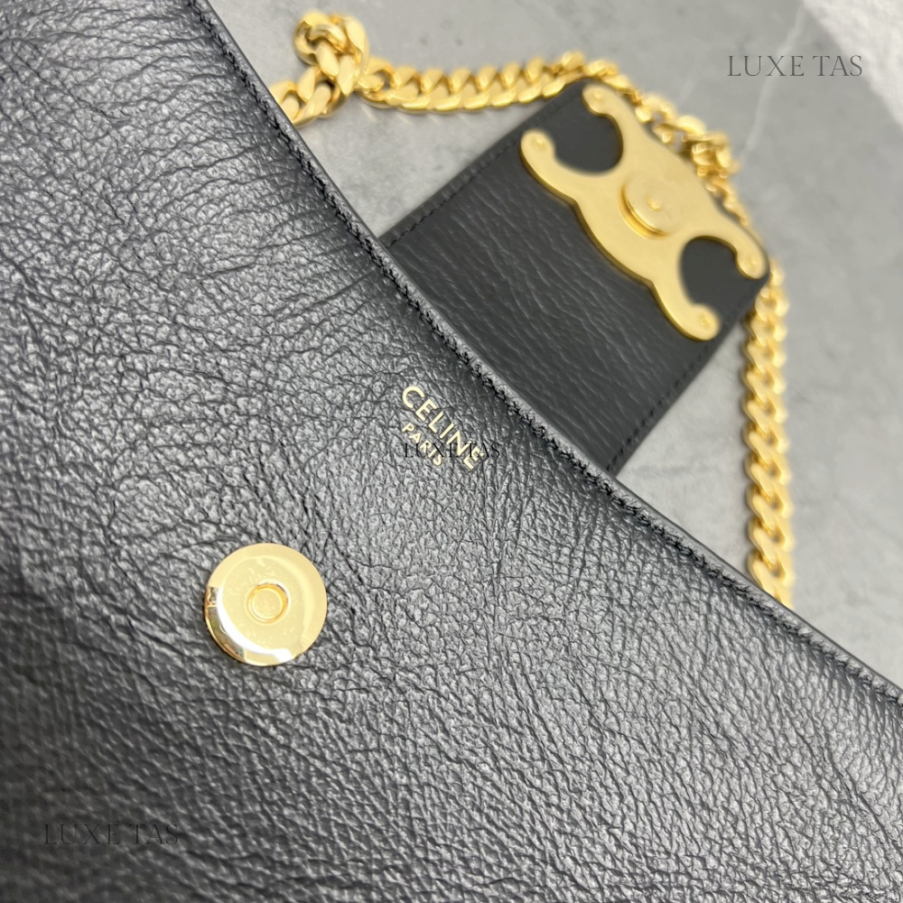 Triomphe clutch in online shiny calfskin