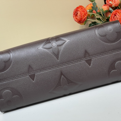 Chocolate Monogram Empreinte Leather OnTheGo MM Leather Tote Bag for Women
