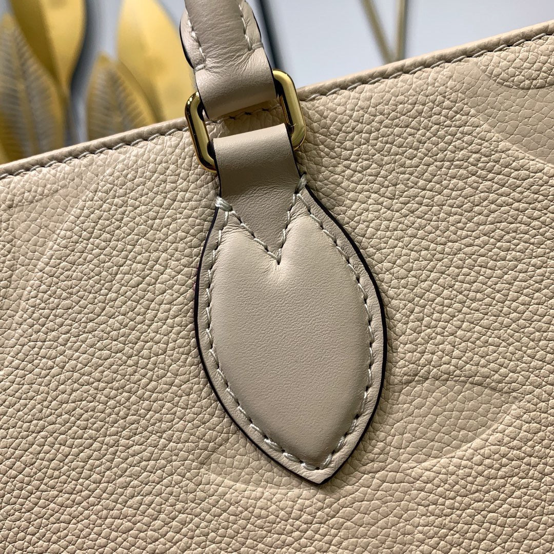 Cream Monogram Empreinte Leather OnTheGo MM - Leather Tote Bag for